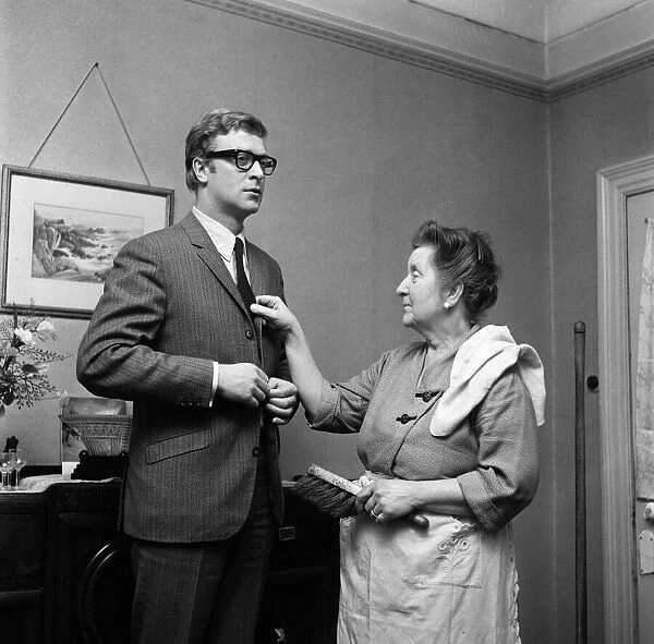 Actor Michael Caine at home with his mother, Ellen. 2nd February 1964