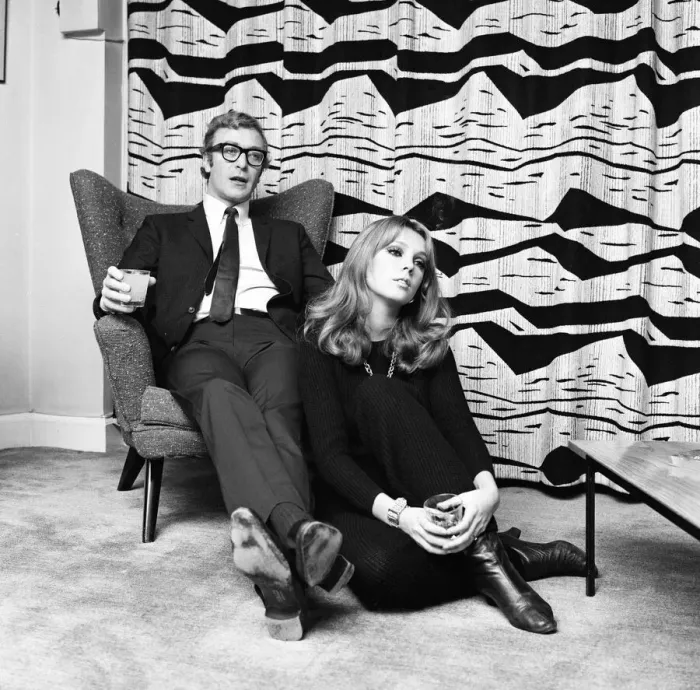 Framed Print : Actor Michael Caine pictured with French actress Miss Elizabeth Ercy in the flat of