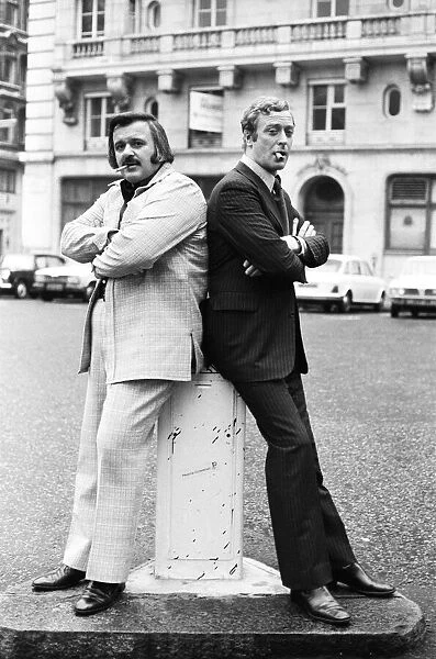 Actor Michael Caine poses with Tony Mascia in Hanover Square during a break in filming
