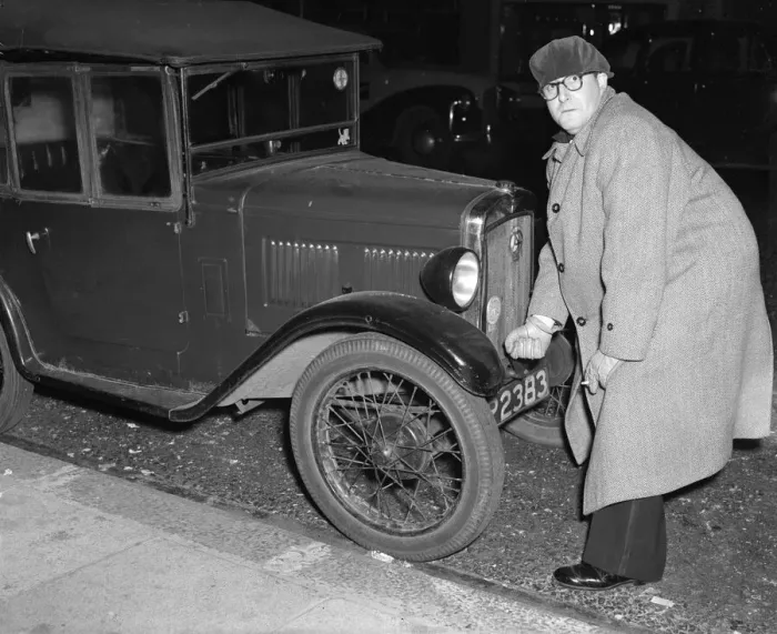 Framed Print : Actor Peter Sellers seen here trying to start his Austin 7 motor car outside the Paris Framed Print : Actor Peter Sellers seen here trying to start his Austin 7 motor car outside the Paris