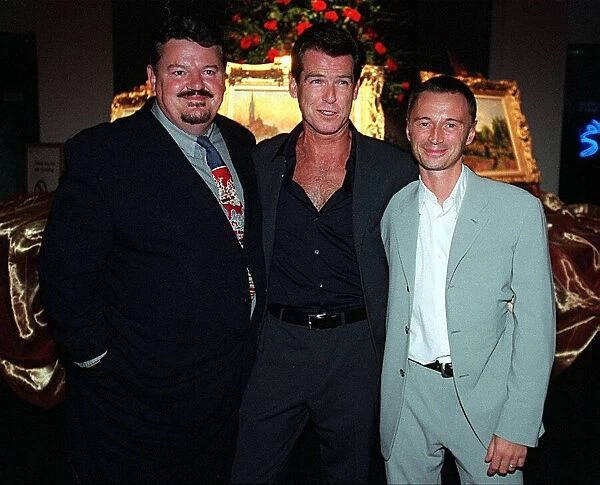 Actor Pierce Brosnan August 1999 with Robert Carlye and Robbie Cotrane at party after