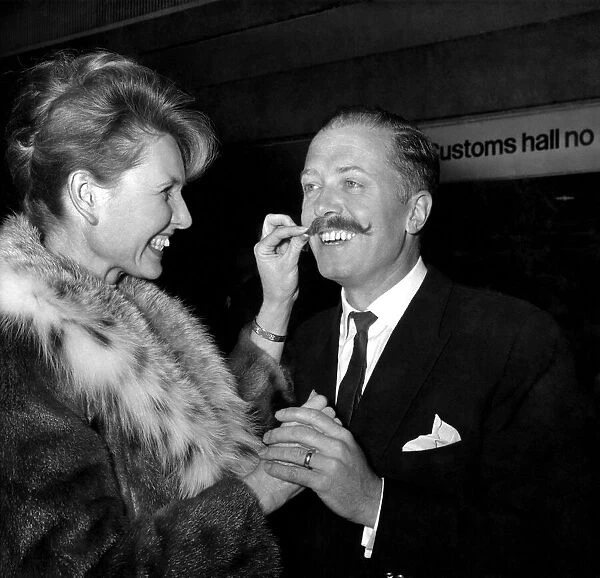 Actor Richard Attenborough is greeted at London Airport on Thursday by his wife Sheila