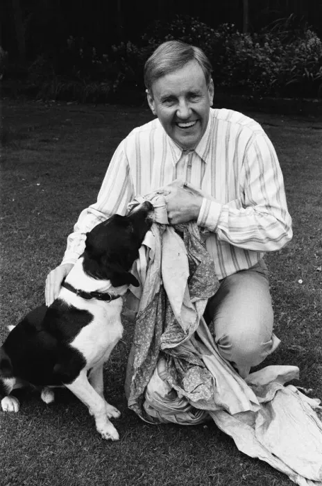 Framed Print : Actor Richard Briers seen here in the back garden of his West London home with his dog