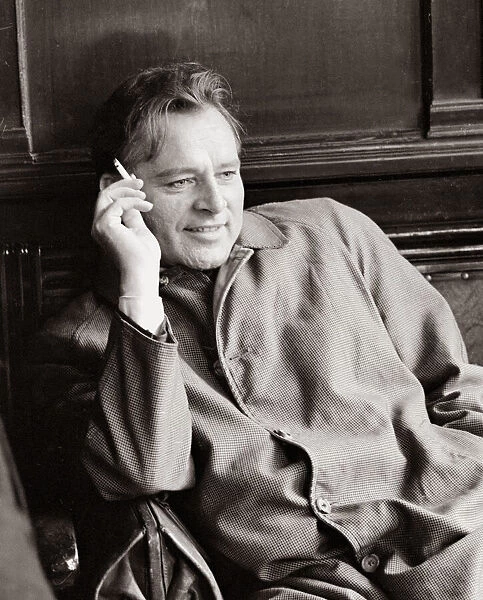 Actor Richard Burton, enjoying a moment of reflection in a London pub while shooting