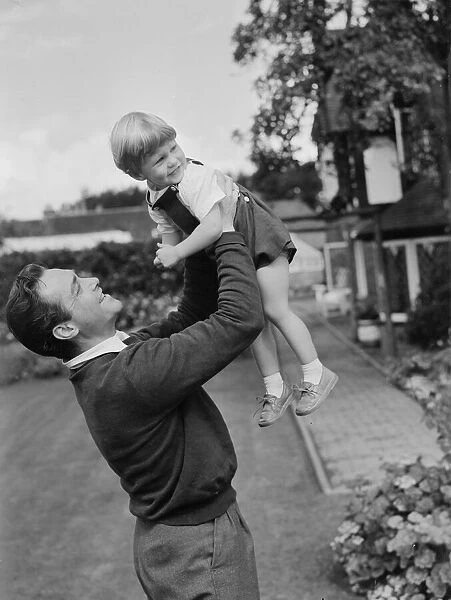Actor Richard Todd playing with his son Peter at home. 5th November 1954