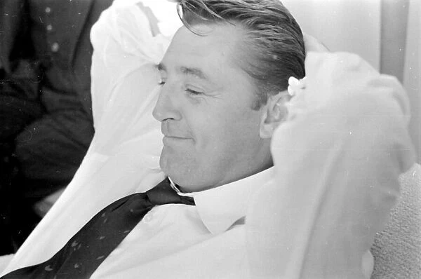 Actor Robert Mitchum during a press interview in London