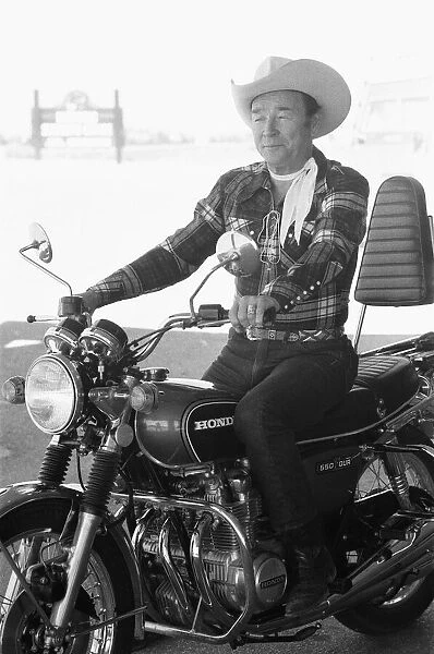 Actor Roy Rogers known as the singing cowboy seen here on a Honda motorbike instead of