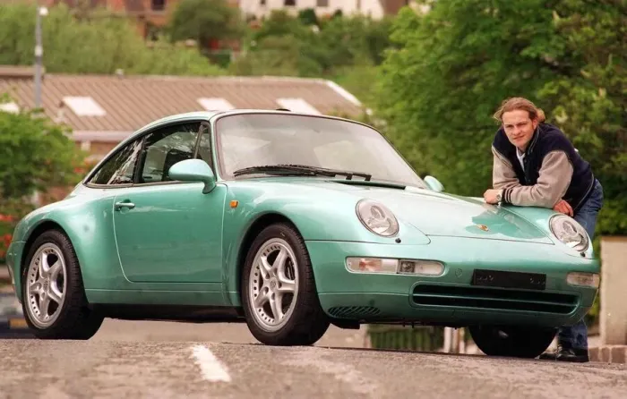 Framed Print : Actor Simon Weir poses by the Porsche Targa 911 car May 1997