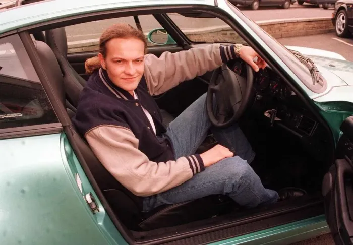 Framed Print : Actor Simon Weir poses sitting in the driving seat of the Porsche Targa 911 car May 1997