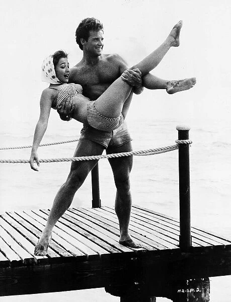 Actor Steve Reeves 1960 standing on a pier by the sea