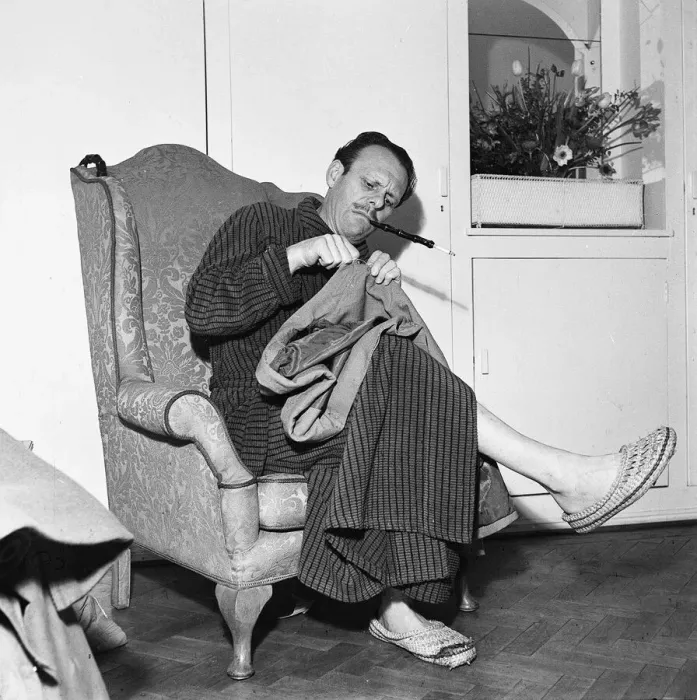 Framed Print : Actor Terry Thomas sitting at home sewing his coat February 1957 Framed Print : Actor Terry Thomas sitting at home sewing his coat February 1957