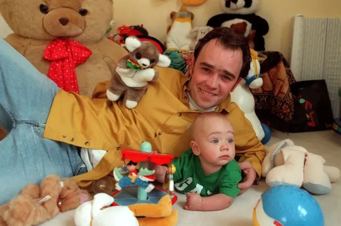 Framed Print : Actor Todd carty at home with baby son James, June 1997