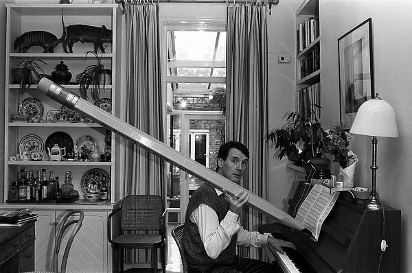 Actor and writer Michael Palin in his study at home. 7th November 1984