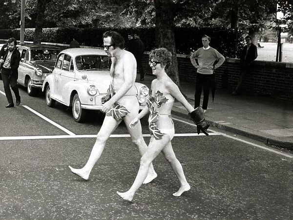 Actors Bill Bailey and Marie Adams crossing Bayswater Road in London naked as they