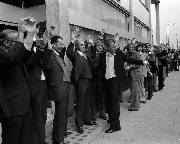 Actors John Thaw and Dennis Waterman frisk 56 men outside the Thames TV building during