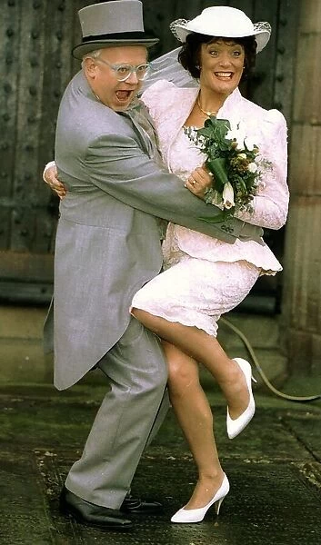 Actors Ken Morley and Sherrie Hewson as Reg Holdsworth and Maureen Naylor getting married