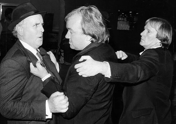 Actors on scene for the television programme Minder. Left to right are George Cole