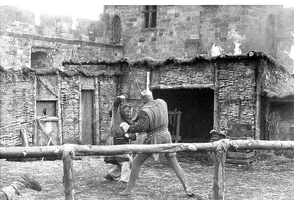 Actors and stunt men fighting hand-to-hand combat in Alnwick Castle in 1981