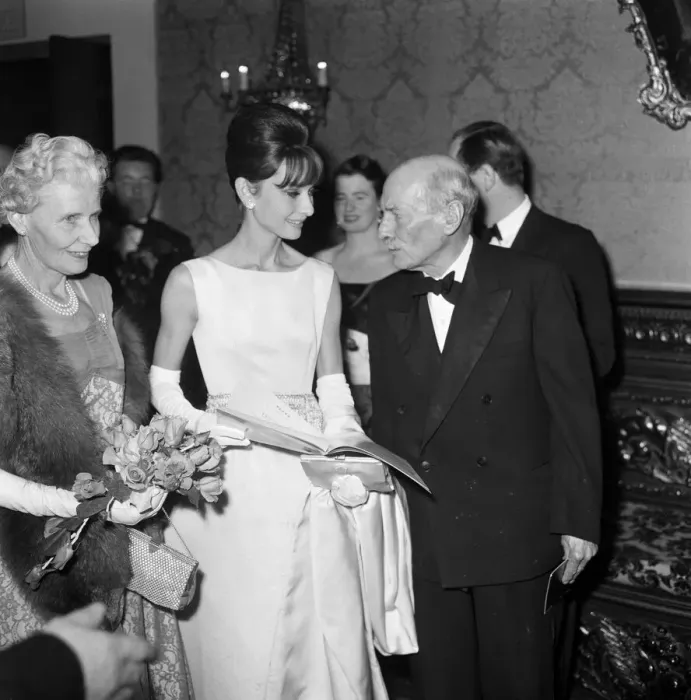 Framed Print : Actress Audrey Hepburn pictured with Earl and Countess Attlee at the London premiere of