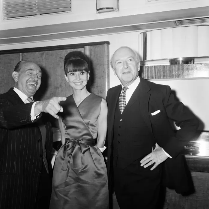 Framed Print : Actress Audrey Hepburn pictured with Jack L Warner (left Framed Print : Actress Audrey Hepburn pictured with Jack L Warner (left