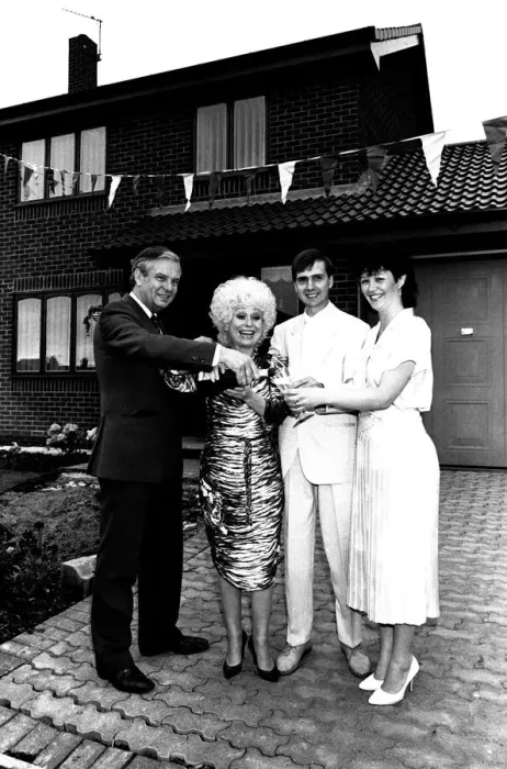 Framed Print : Actress Barbara Windsor proposes a house-warming toast to DIY builders Allan Framed Print : Actress Barbara Windsor proposes a house-warming toast to DIY builders Allan