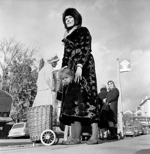 actress Francis Dean who lives in Fairfax Road, N. W. 6. wears a maxi-coat