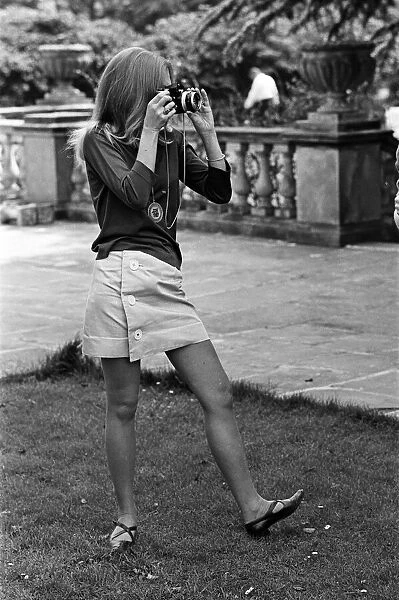 Actress Hayley Mills holding a camera. 13th May 1967