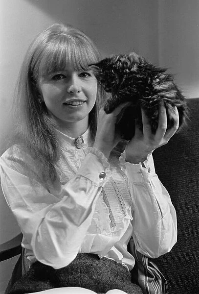 Actress Jane Asher holding a kitten 1965