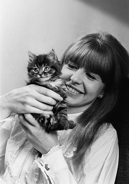 Actress Jane Asher holding a kitten 1965
