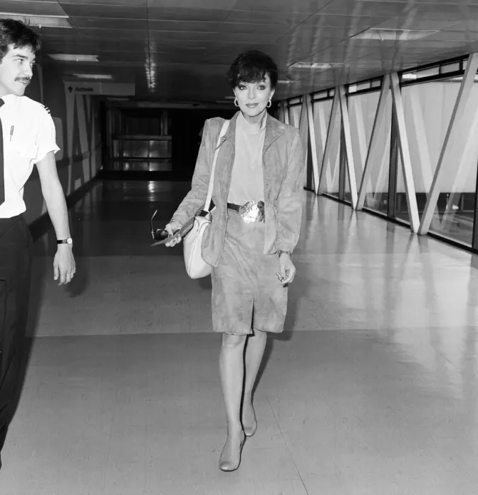 Framed Print : Actress Joan Collins at an airport. May 1982 Framed Print : Actress Joan Collins at an airport. May 1982