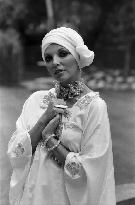 Framed Print : Actress Joan Collins modelling outfits that she will wear on a trip to Tokyo to judge a Framed Print : Actress Joan Collins modelling outfits that she will wear on a trip to Tokyo to judge a