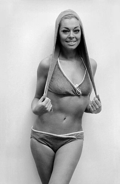 Actress Joan Crane was modelling a four-piece zip up swimsuit in stretch fabric by