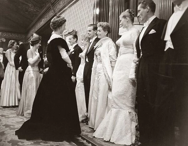 Actress Joan Crawford at the Royal Film Show, talking to Her majesty Queen Elibazeth II
