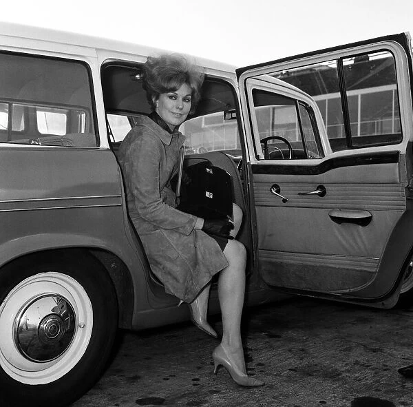 Actress Kim Novak leaving London Airport for France. 11th October 11th October 1965