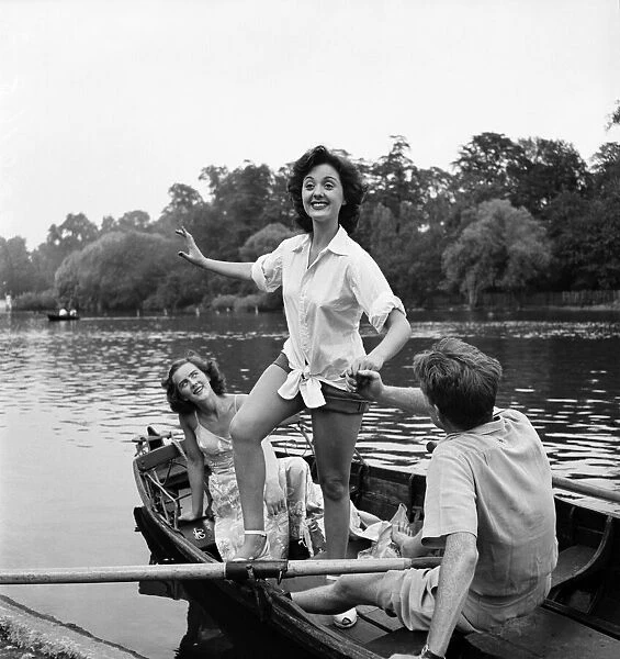 Actress Lana Morris wears a shirt over her shorts. August 1949 O20168