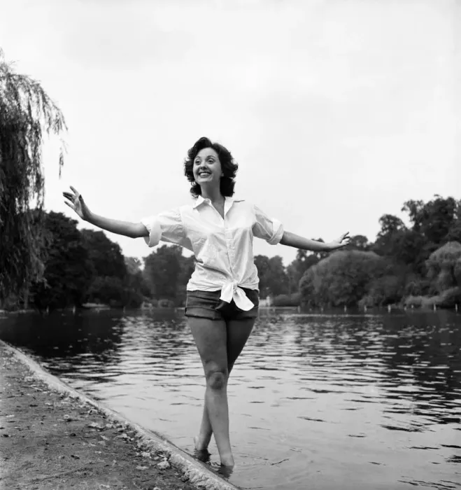 Framed Print : Actress Lana Morris wears a shirt over her shorts. August 1949 O20168-001