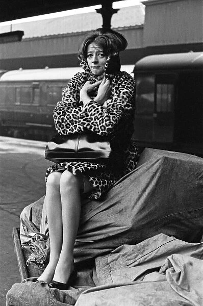 Actress Maggie Smith pictured on a train station platform as she waits for a train