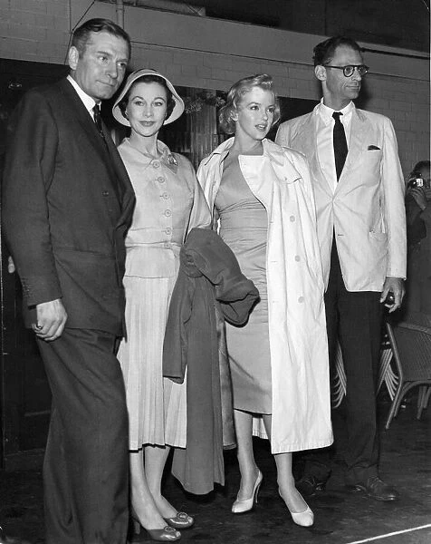 Actress Marilyn Monroe pictured with her playwright husband Arthur Miller having arrived