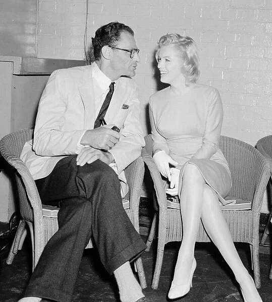 Actress Marilyn Monroe and playwright husband Arthur Miller seen here at London Airport