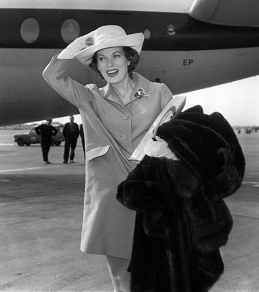 Actress Maureen O Hara arrives at London Airport on her way to Milan for costume