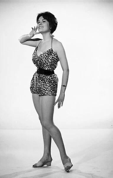 Actress and model Wendy Richard seen here modelling a leopard print swimsuit