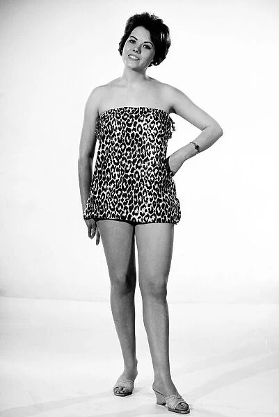 Actress and model Wendy Richard seen here modelling a leopard print beach dress