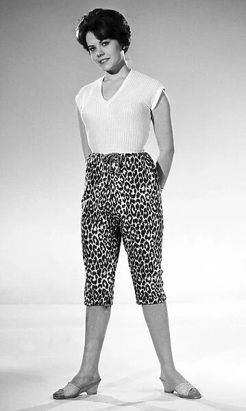 Actress and model Wendy Richard seen here modelling a pair of leopard print jeans