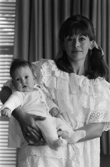 Framed Print : Actress Nanette Newman with her 4 month old daughter Emma at their home in Virginia Water