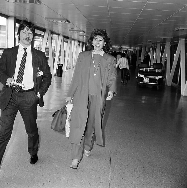 Actress Nanette Newman leaving Heathrow Airport for Australia. 24th March 1986