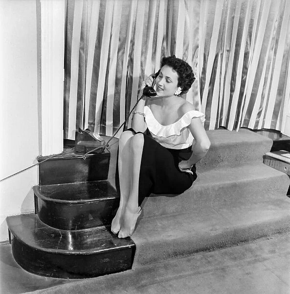 Actress Pascale Roberts talking on the telephone. October 1952 C5204-001