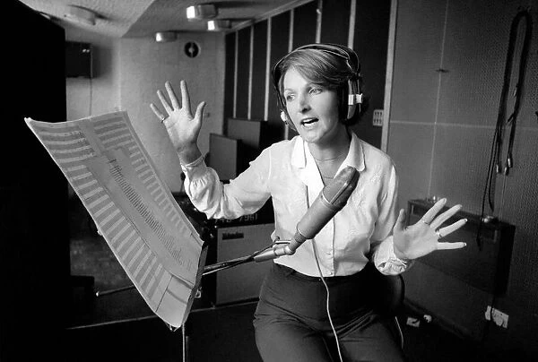 Actress Penelope Keith makes a record about a Dachsund dog. June 1980 80-03067-009