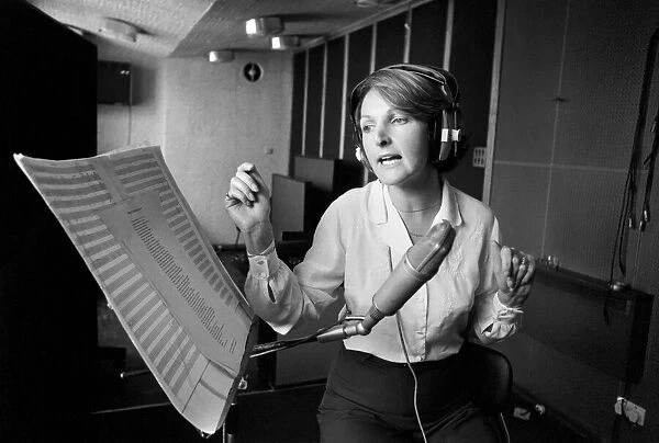 Actress Penelope Keith makes a record about a Dachsund dog. June 1980 80-03067-002