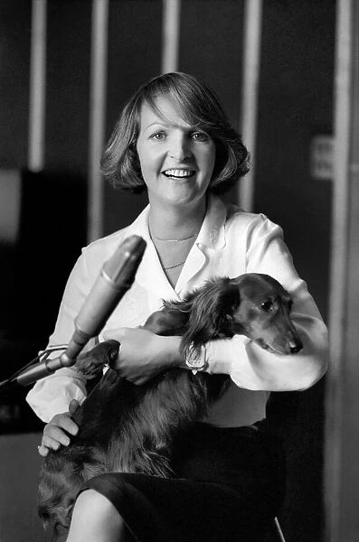 Actress Penelope Keith makes a record about a Dachsund dog. June 1980 80-03067-008