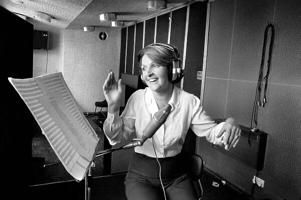 Actress Penelope Keith makes a record about a Dachsund dog. June 1980 80-03067-006